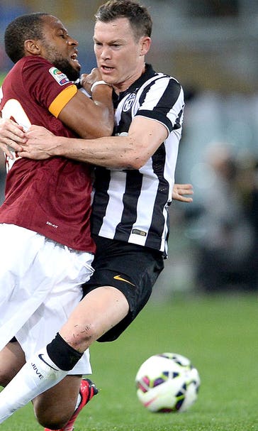 Juventus hold off 10-man Roma to maintain lead at top of Serie A